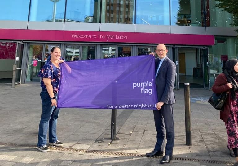 Roy Holding Purple Flag